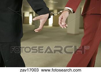 Stock Photo - businesspeople 
handcuffed together. 
fotosearch - search 
stock photos, 
pictures, images, 
and photo clipart