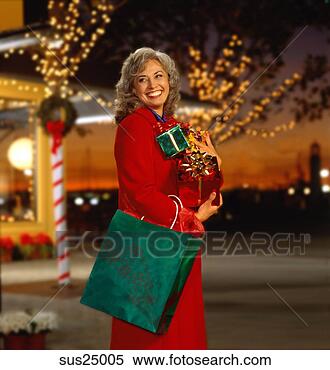 Stock Image - caucasian woman 
christmas shopping. 
fotosearch - search 
stock photos, 
pictures, images, 
and photo clipart