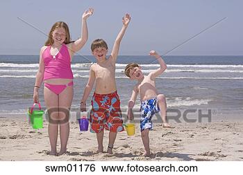 Stock Photo - children holding 
buckets and waving 
on beach. fotosearch 
- search stock 
photos, pictures, 
images, and photo 
clipart