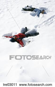 Stock Photography - children making 
snow angels. fotosearch 
- search stock 
photos, pictures, 
images, and photo 
clipart