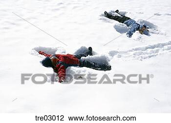Stock Photo - children making 
snow angels. fotosearch 
- search stock 
photos, pictures, 
images, and photo 
clipart