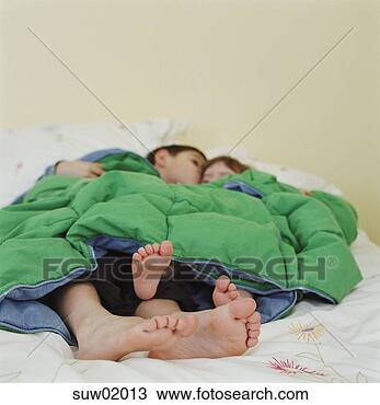 Stock Photo - children's bare 
feet beneath blanket. 
fotosearch - search 
stock photos, 
pictures, images, 
and photo clipart