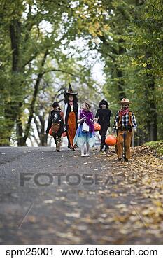 Stock Photography - children trick 
or treating on 
halloween. fotosearch 
- search stock 
photos, pictures, 
images, and photo 
clipart
