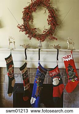Stock Photo - christmas stockings 
over fireplace. 
fotosearch - search 
stock photos, 
pictures, images, 
and photo clipart
