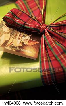 Stock Photo - close-up of gift 
with plaid bow. 
fotosearch - search 
stock photos, 
pictures, images, 
and photo clipart