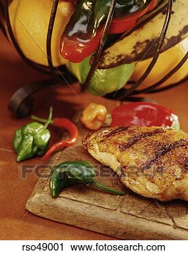 Stock Photography - close up of grilled 
chicken and peppers 
on cutting board. 
fotosearch - search 
stock photos, 
pictures, images, 
and photo clipart