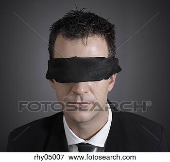 Picture - close-up of man 
wearing a blindfold. 
fotosearch - search 
stock photos, 
pictures, images, 
and photo clipart