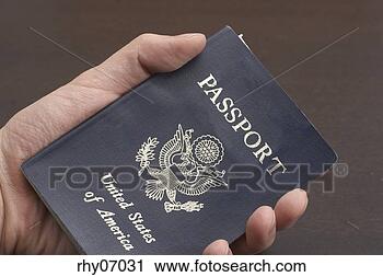 Stock Photography - close up of man's 
hand holding passport. 
fotosearch - search 
stock photos, 
pictures, images, 
and photo clipart