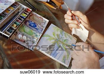 Stock Photograph - close-up of person's 
hands painting 
with watercolors. 
fotosearch - search 
stock photos, 
pictures, images, 
and photo clipart