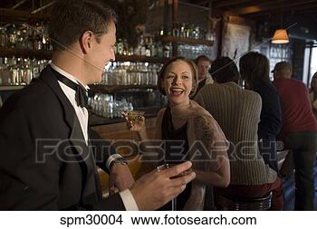 Stock Photo - couple at bar. 
fotosearch - search 
stock photos, 
pictures, images, 
and photo clipart