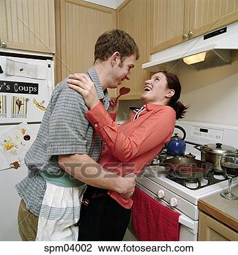 Stock Photo - couple dancing 
in kitchen. fotosearch 
- search stock 
photos, pictures, 
images, and photo 
clipart