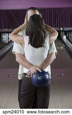 Stock Photography - couple kissing 
in bowling alley. 
fotosearch - search 
stock photos, 
pictures, images, 
and photo clipart
