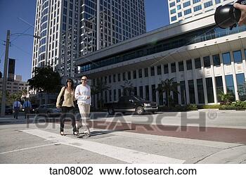 Stock Photo - couple walking 
along urban street, 
ft lauderdale, 
florida. fotosearch 
- search stock 
photos, pictures, 
images, and photo 
clipart