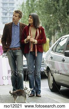 Stock Photography - couple walking 
small dog. fotosearch 
- search stock 
photos, pictures, 
images, and photo 
clipart