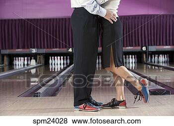 Stock Photo - couple wearing 
bowling shoes 
hugging in bowling 
alley. fotosearch 
- search stock 
photos, pictures, 
images, and photo 
clipart