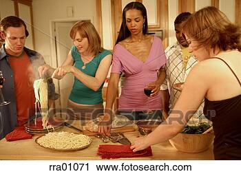 Stock Photography - couples cooking 
in kitchen. fotosearch 
- search stock 
photos, pictures, 
images, and photo 
clipart