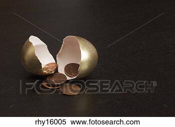 Stock Image - cracked golden 
egg containing 
pennies. fotosearch 
- search stock 
photos, pictures, 
images, and photo 
clipart