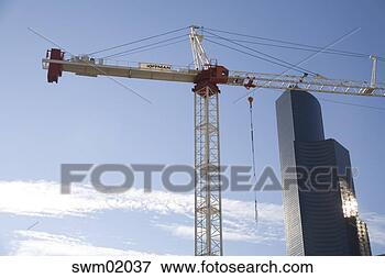 Picture - crane positioned 
beside high-rise 
building, seattle, 
washington. fotosearch 
- search stock 
photos, pictures, 
images, and photo 
clipart