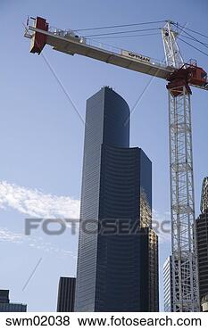 Stock Photo - crane positioned 
beside high-rise 
buildings, seatlte, 
washington. fotosearch 
- search stock 
photos, pictures, 
images, and photo 
clipart