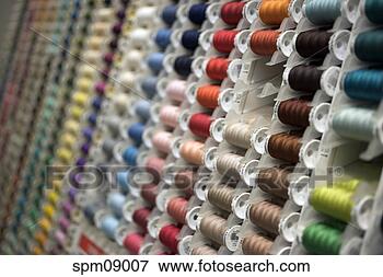 Picture - different colored 
spools of thread 
on display. fotosearch 
- search stock 
photos, pictures, 
images, and photo 
clipart