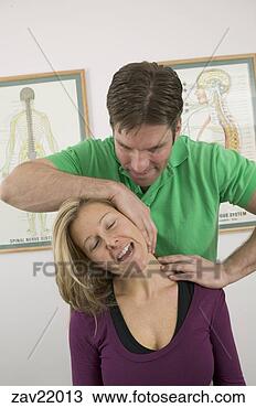 Stock Photo - doctor cracking 
woman's neck. 
fotosearch - search 
stock photos, 
pictures, images, 
and photo clipart