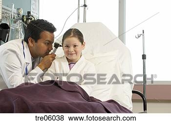 Stock Photo - doctor examining 
girl's ears. fotosearch 
- search stock 
photos, pictures, 
images, and photo 
clipart