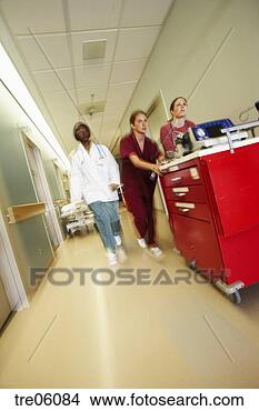 Stock Photo - doctor and nurses 
pushing medical 
cart through corridor. 
fotosearch - search 
stock photos, 
pictures, images, 
and photo clipart