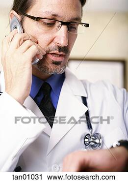 Stock Photography - doctor talking 
on cell phone. 
fotosearch - search 
stock photos, 
pictures, images, 
and photo clipart