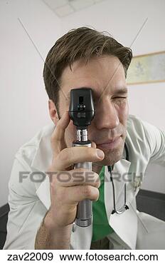 Stock Photograph - doctor using optical 
instrument. fotosearch 
- search stock 
photos, pictures, 
images, and photo 
clipart