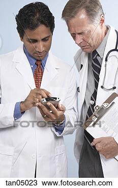 Stock Photo - doctors checking 
schedule on pda. 
fotosearch - search 
stock photos, 
pictures, images, 
and photo clipart