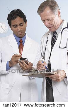 Picture - doctors checking 
schedule on pda. 
fotosearch - search 
stock photos, 
pictures, images, 
and photo clipart