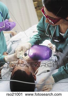 Stock Photography - doctors preparing 
patient for surgery. 
fotosearch - search 
stock photos, 
pictures, images, 
and photo clipart