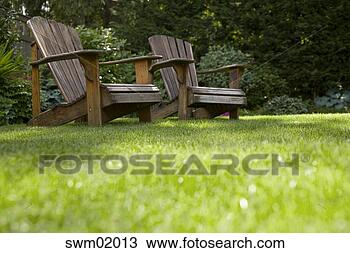 Stock Photo - empty lawn chairs 
in backyard. fotosearch 
- search stock 
photos, pictures, 
images, and photo 
clipart