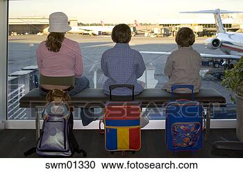 Stock Photography - family waiting 
in airport. fotosearch 
- search stock 
photos, pictures, 
images, and photo 
clipart