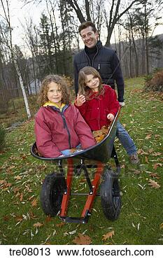 Stock Photo - father pushing 
daughters in wheelbarrow. 
fotosearch - search 
stock photos, 
pictures, images, 
and photo clipart