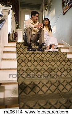 Stock Photo - father talking 
to daughter on 
staircase. fotosearch 
- search stock 
photos, pictures, 
images, and photo 
clipart