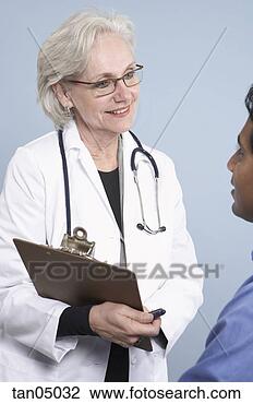 Stock Photo - female doctor 
questioning patient. 
fotosearch - search 
stock photos, 
pictures, images, 
and photo clipart