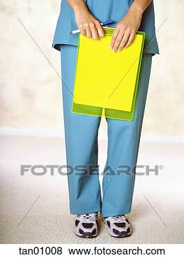 Stock Photo - female nurse holding 
clipboard. fotosearch 
- search stock 
photos, pictures, 
images, and photo 
clipart