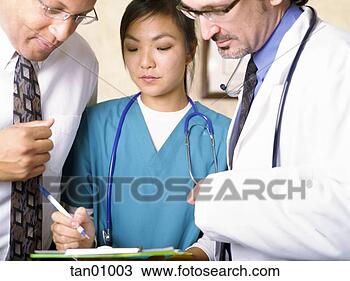 Stock Photo - female nurse and 
male doctors writing 
on clipboard. 
fotosearch - search 
stock photos, 
pictures, images, 
and photo clipart