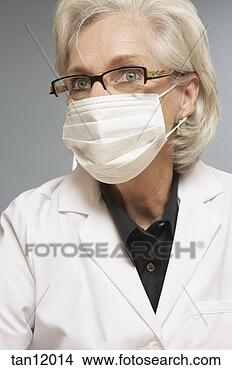 Stock Photo - female scientist 
wearing mask. 
fotosearch - search 
stock photos, 
pictures, images, 
and photo clipart