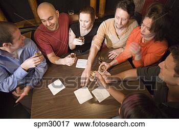 Picture - friends drinking 
shots in a bar. 
fotosearch - search 
stock photos, 
pictures, images, 
and photo clipart