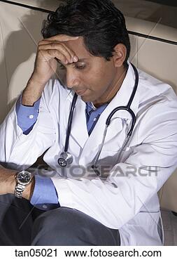 Stock Photography - frustrated doctor 
of indian ethnicity. 
fotosearch - search 
stock photos, 
pictures, images, 
and photo clipart