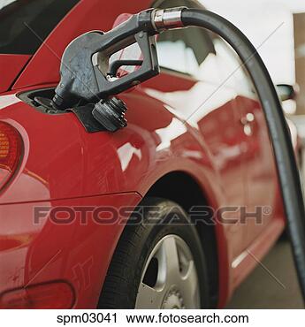 Stock Photography - gas pump filling 
car's tank. fotosearch 
- search stock 
photos, pictures, 
images, and photo 
clipart