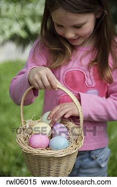 Stock Image - girl counting 
easter eggs in 
easter basket. 
fotosearch - search 
stock photos, 
pictures, images, 
and photo clipart