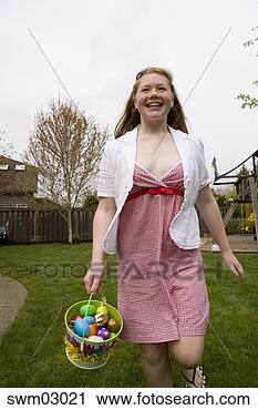 Stock Photography - girl on easter 
egg hunt. fotosearch 
- search stock 
photos, pictures, 
images, and photo 
clipart