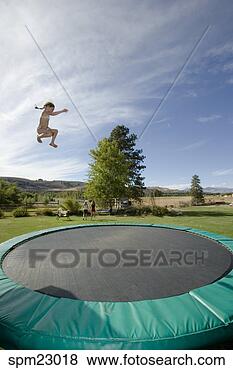 Stock Photo - girl jumping on 
trampoline. fotosearch 
- search stock 
photos, pictures, 
images, and photo 
clipart