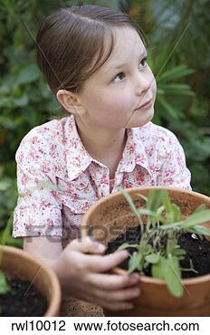 Stock Photo - girl potting plants. 
fotosearch - search 
stock photos, 
pictures, images, 
and photo clipart