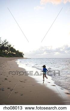 Stock Photo - girl running on 
beach in kauai, 
hawaii islands. 
fotosearch - search 
stock photos, 
pictures, images, 
and photo clipart