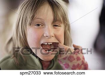 Stock Photo - girl showing missing 
teeth. fotosearch 
- search stock 
photos, pictures, 
images, and photo 
clipart