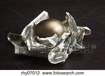 Stock Photo - golden egg in 
nest of dollar 
bills. fotosearch 
- search stock 
photos, pictures, 
images, and photo 
clipart